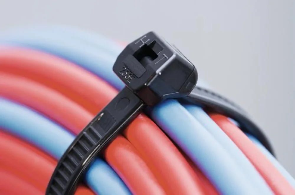 Black cable tie on hose bundle